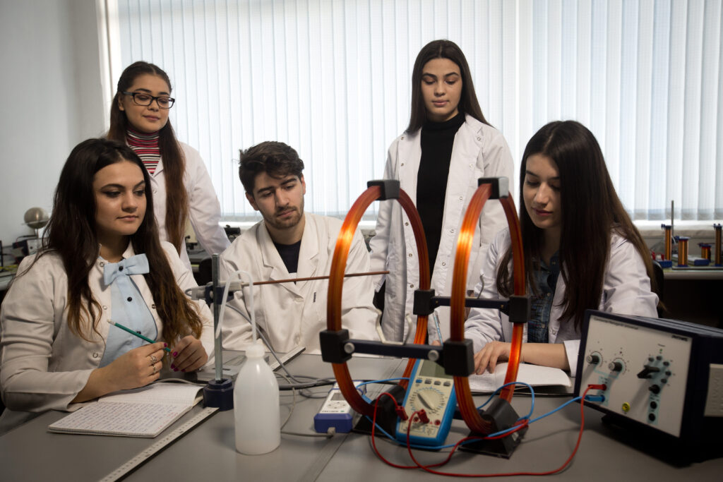 Group of students in a laboratory experimenting with science tools